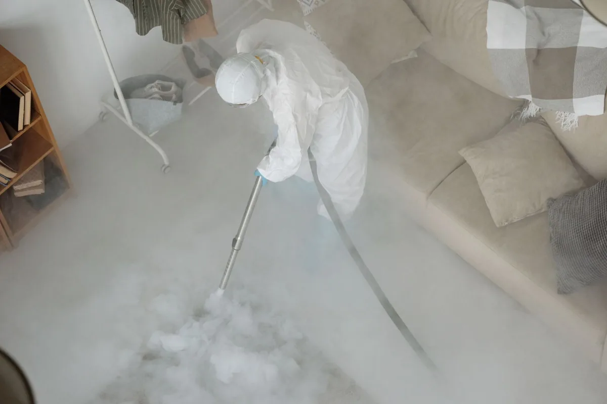 Biohazard cleanup technician in protective equipment, Brilliant, AL